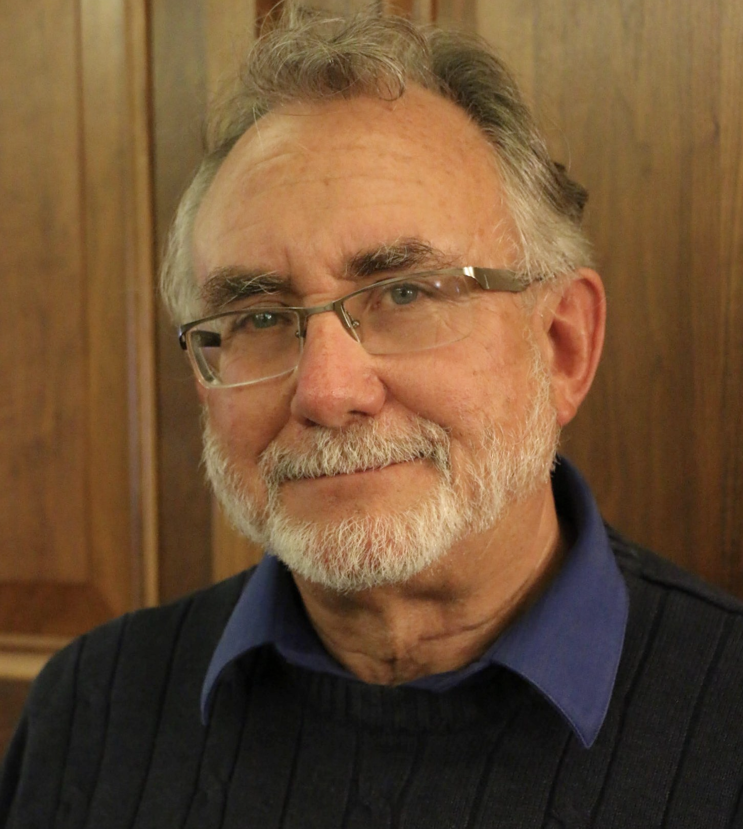 Dr. Landon Male physician, medical director, smiling with glasses.